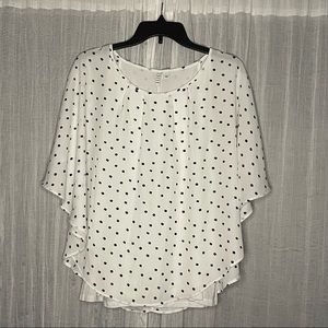 White a black polka dotted blouse